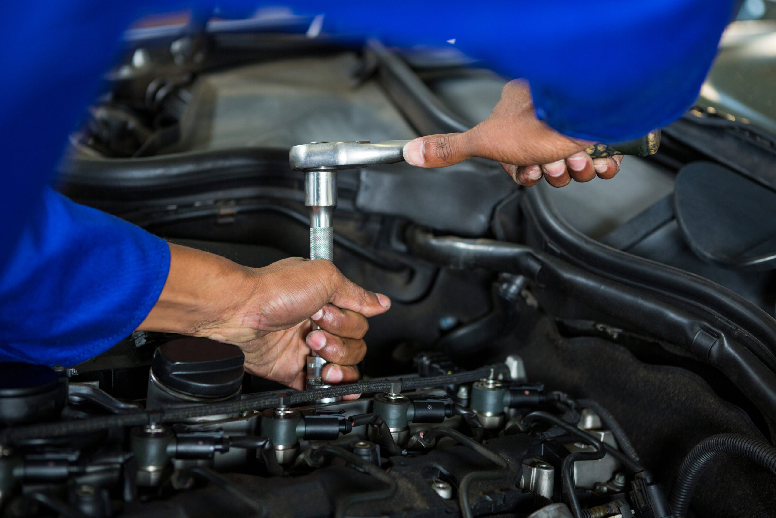 Mechanic servicing a car at repair garage