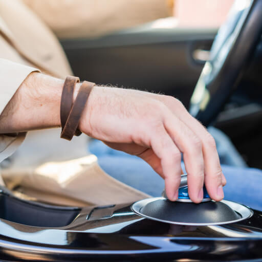 Person using a touchscreen control in an electric vehicle at Garage-EV Dartmouth.