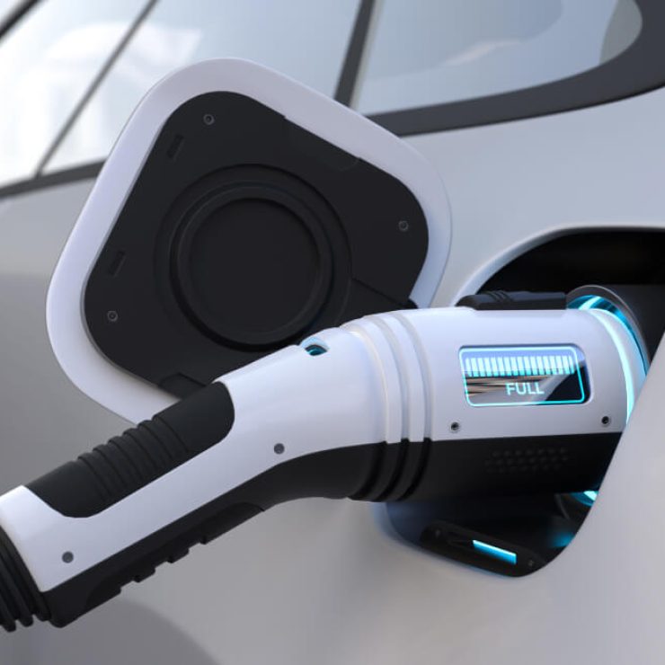 Electric vehicle being charged at a modern charging station in Dartmouth.