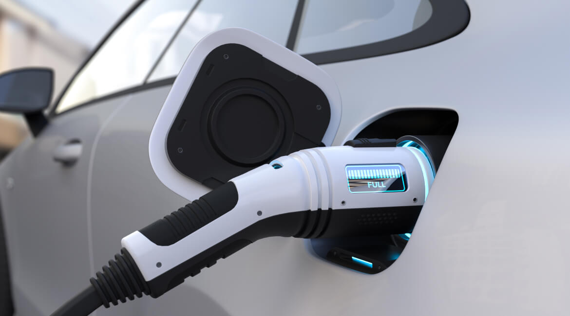 Electric vehicle being charged at a modern charging station in Dartmouth.