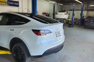 Electric car in garage at Garage-EV vehicle service center.