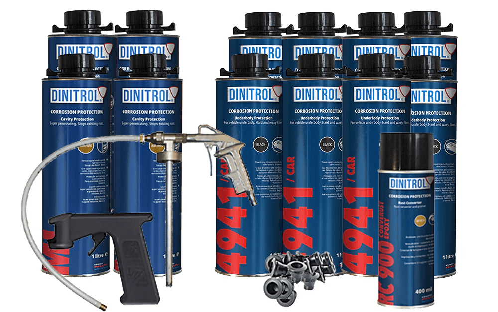 Multiple Dinitrol corrosion protection spray cans with spray gun for vehicle protection.