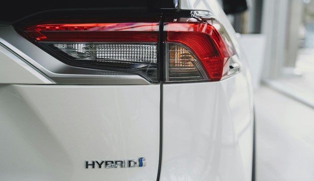 Close-up of hybrid vehicle tail light and hybrid badge in Dartmouth.