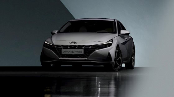 Silver Hyundai Avante Hybrid vehicle in a modern setting.