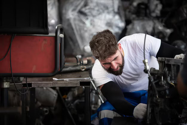 Man repairing car engine