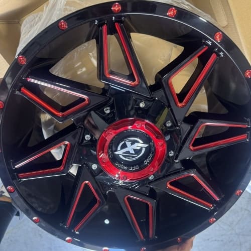 Custom black and red alloy wheel for sports cars and trucks.