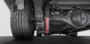 Close-up of a car's suspension and tire, showcasing quality automotive components.