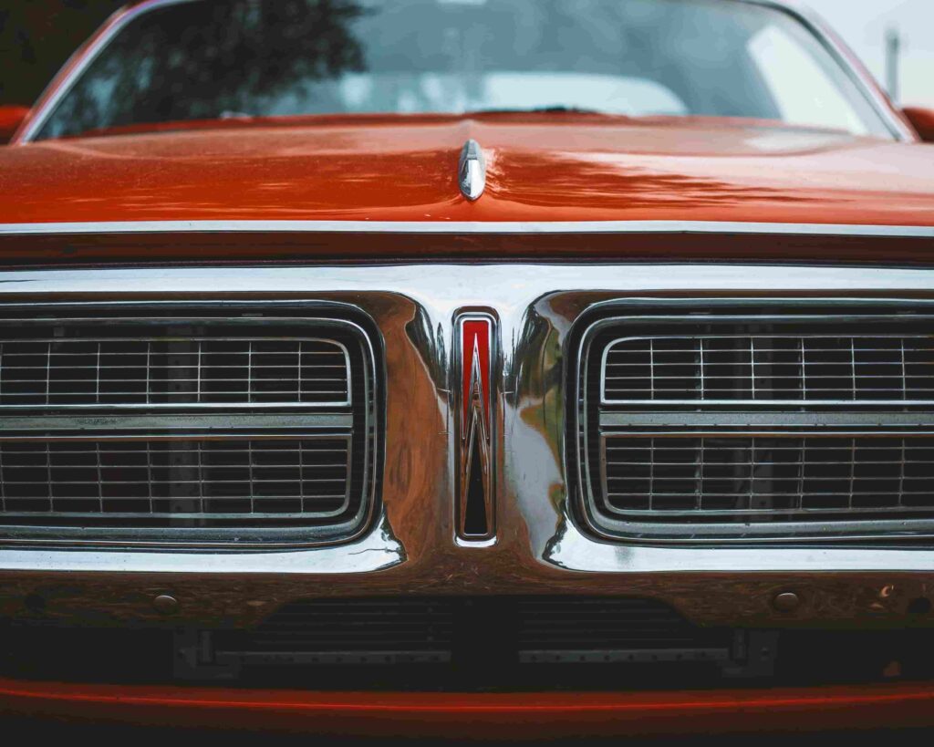 Close-up of a classic hot rod front grille with chrome details.