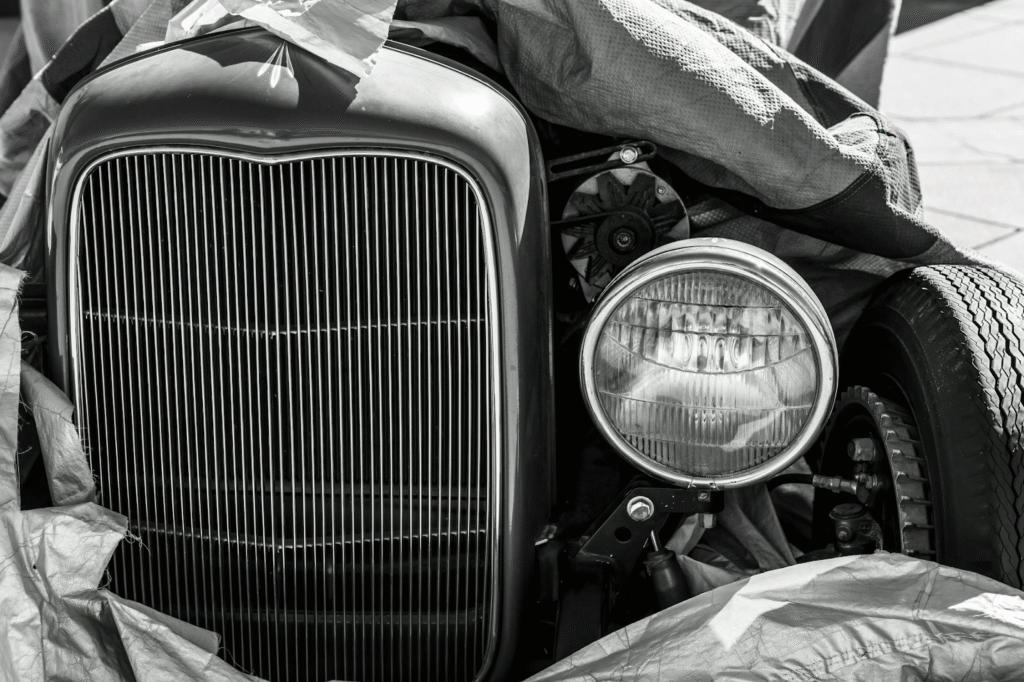 Classic hot rod front grille with headlight, vintage style.