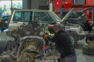 mechanic-repairing-car-engine-workshop