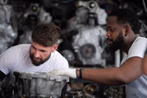 two-men-repairing-car-engine-auto-repair-shop-selective-focus_