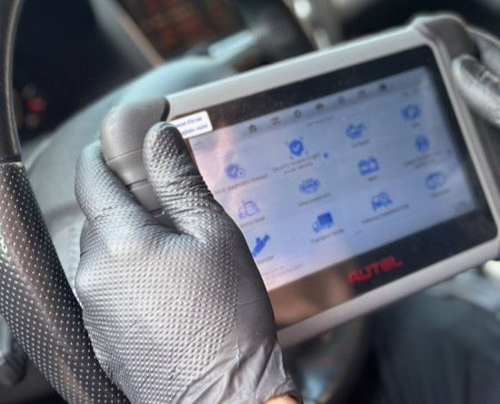 Transmission repair diagnostic tool in use.