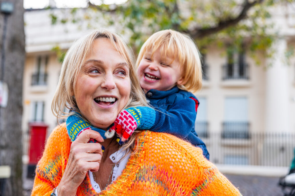 Grandmother and grandson laughing together on a day out