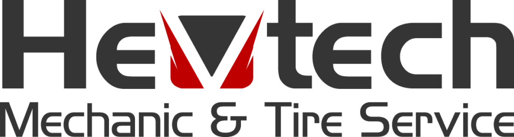 Skilled mechanic working on a vehicle at HeVtech Tire Services.