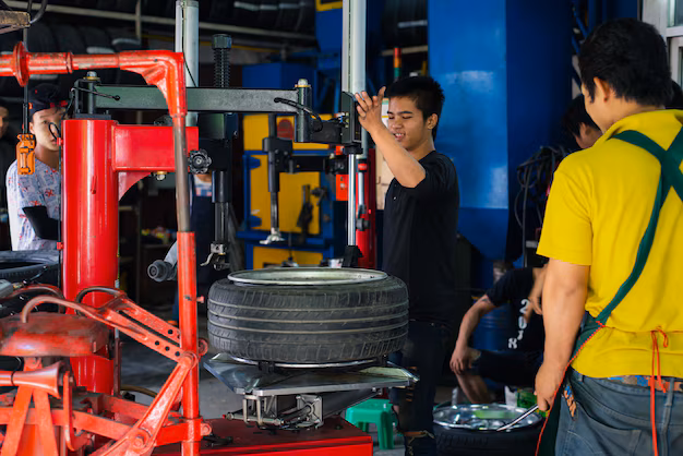 Mechanic performing tire repairs