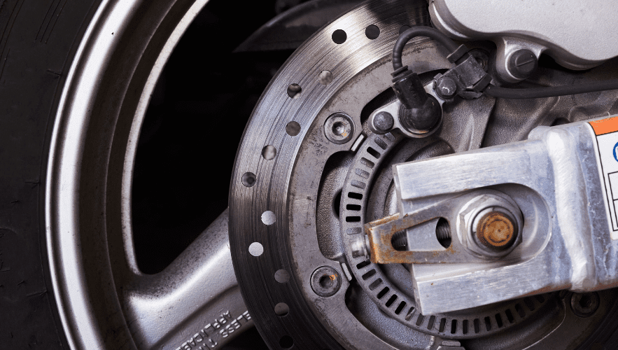 Brake system components on a motorcycle wheel.