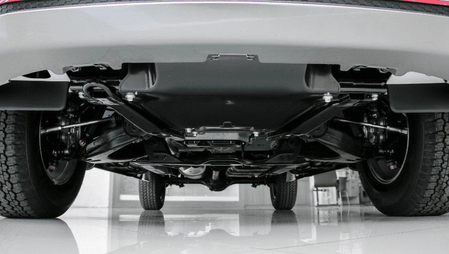 View of car's undercarriage during auto repair service at Hillside Auto Clinic.