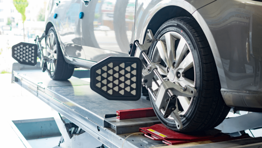 Car wheel alignment being performed at Hillside Auto Clinic.