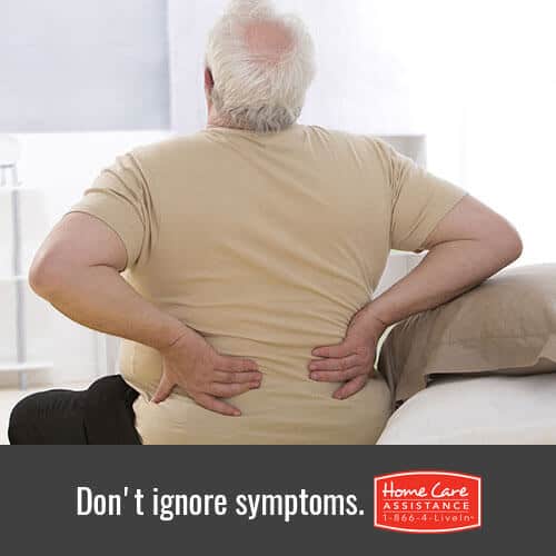Senior experiencing joint pain as a sign of arthritis