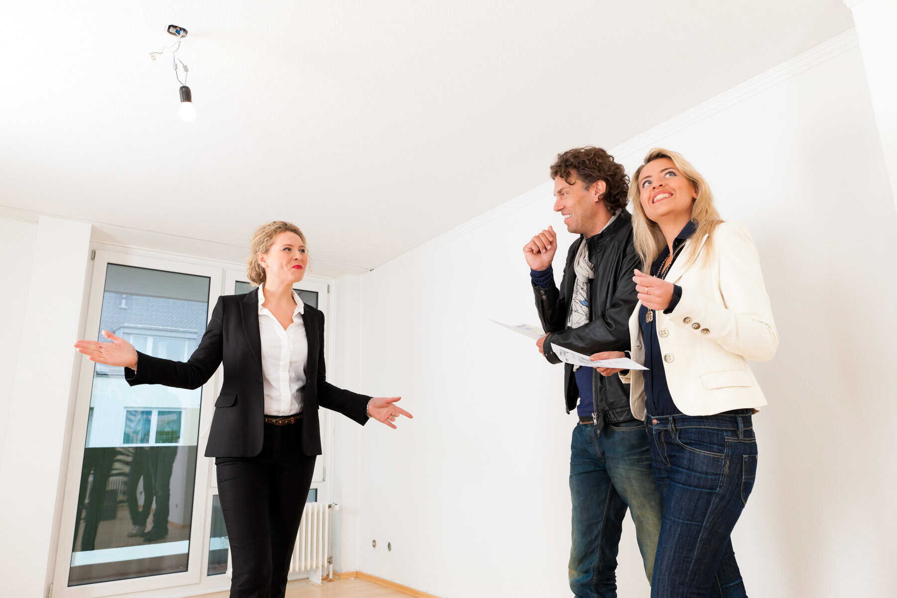 Real estate market - young couple looking for real estate to rent or buy an apartment
