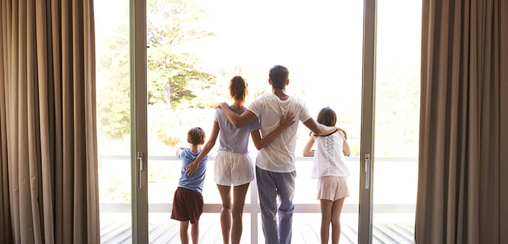 family looking out window