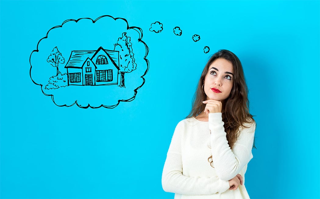 Home Mortgage Affordability, A gray house, brown card and calcul