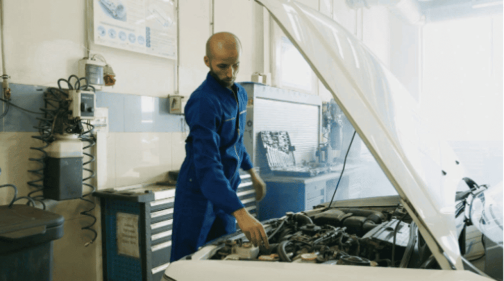 Engine technician performing vehicle inspection at Honest Engine Roseville.