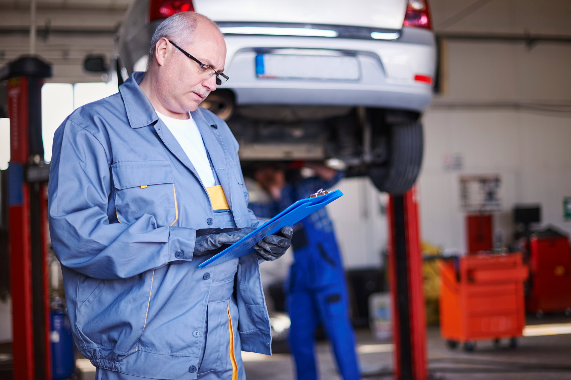 Vehicle undergoing maintenance at auto repair shop
