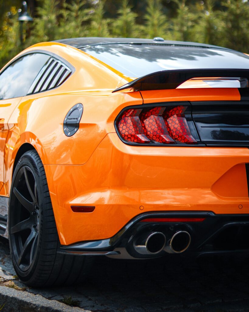 Orange sports car with sleek design and dual exhausts at Honest Engine of Roseville.