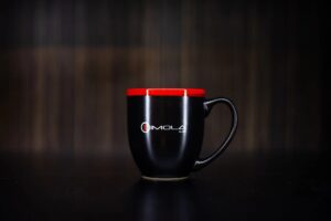 Imola Motorsports two-tone halo bistro mug with red and black design.
