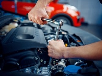 Car engine maintenance at Imola Motorsports.