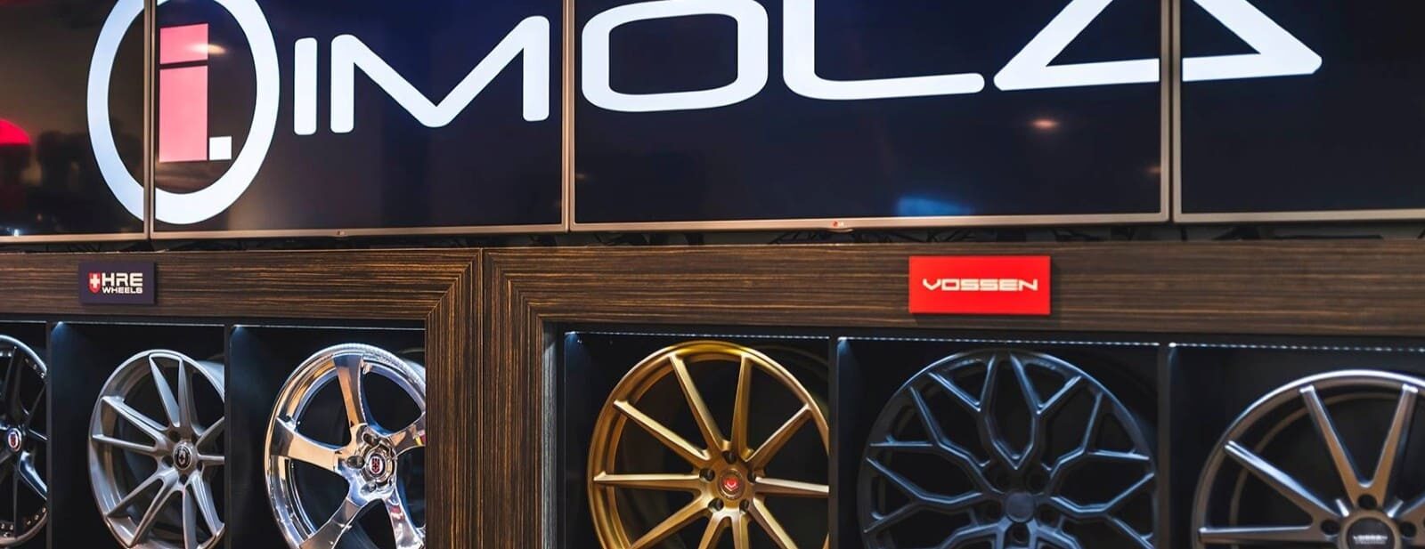 High-quality alloy wheels showcased at Imola Motorsports store.