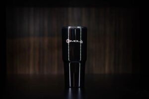 Imola Motorsports 32 oz. double wall travel mug on dark background.