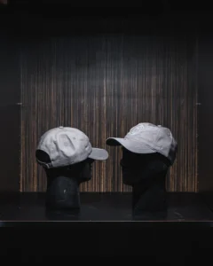 Gray baseball cap displayed on mannequin head.