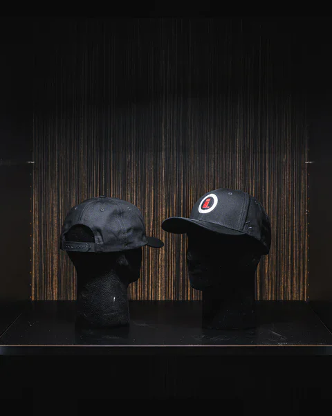 Black snapback hat with Imola Motorsports logo, stylish and sporty accessory.