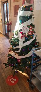 Decorated Christmas tree at Inchmarlo estate, festive holiday celebration in Scotland.