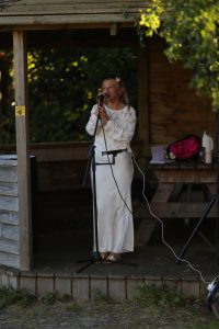 Outdoor singer performing at Inchmarlo estate in Scotland, showcasing scenic beauty and event hosting.
