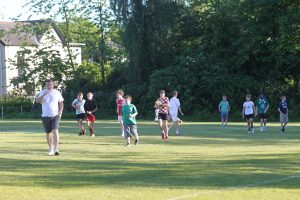 People playing golf at Inchmarlo golf course in sunny weather.
