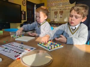 Children engaging in educational activities at Inchmarlo nursery.