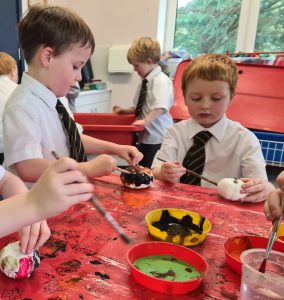 Young children engaging in arts and crafts activity at Inchmarlo school.