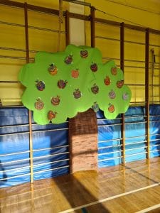 Colorful paper apple tree decoration for Inchmarlo community event.