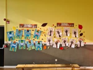 Colorful children's artwork display at Inchmarlo care home.