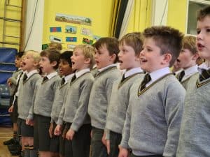 Children in school uniform standing in line at Inchmarlo School.