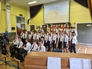 Students performing at Inchmarlo school assembly in Aberdeenshire.