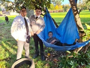 Family enjoying outdoor activities at Inchmarlo in a lush green park setting.