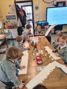 Children engaging in creative arts and crafts at Inchmarlo preschool.