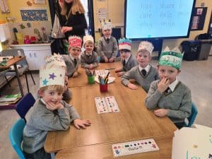 Children in festive paper crowns at Inchmarlo for Christmas activities.