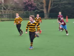 Children playing rugby at Inchmarlo school sports day.