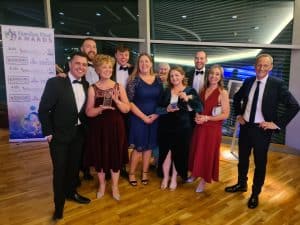 Group of elegantly dressed people at Inchmarlo event, celebrating awards and achievements.