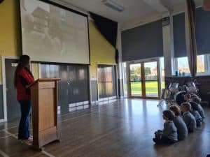 Children enjoying a virtual show at Inchmarlo, a Scottish country estate with versatile event facilities.